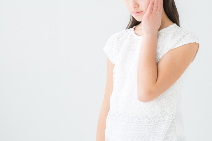矯正治療後の後戻りに悩む子ども
